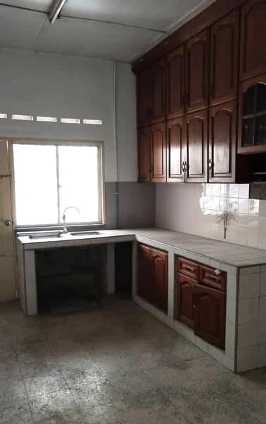 Kitchen features: wooden cabinetry with brown finish, white tiled countertop, single-bowl stainless-steel sink, chrome pull-down faucet, window above sink, grey tiled backsplash, light grey floor tiles, wall-mounted cabinets, open shelving, fluorescent ceiling light; style: traditional.