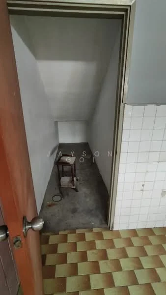 Room features: white painted walls, concrete flooring, small space, doorway, no visible windows, checkered tile flooring.