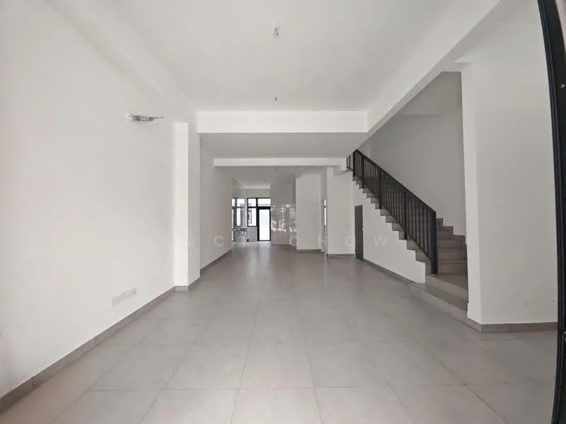 Room features: white painted walls, grey tiled flooring, staircase with black railing, large windows allowing natural light, open layout, high ceiling, no visible furniture, neutral color scheme; style: modern.
