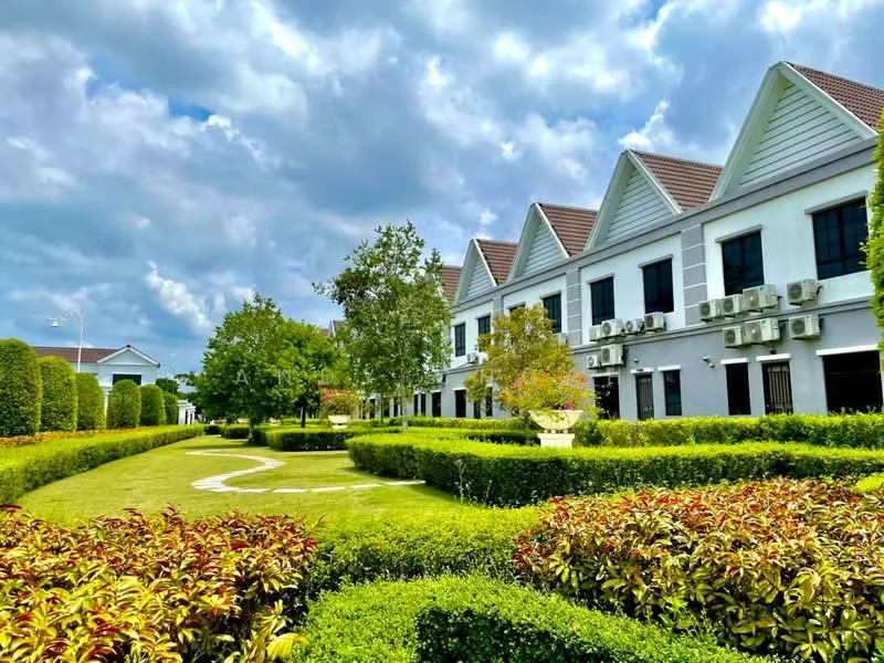 Exterior type: linked terrace house; features: white painted facade, pitched tile roof, multiple wall-mounted split AC units, manicured lawn, mature trees, tropical landscaping, flowering shrubs, stone-paved walkway; style: modern.