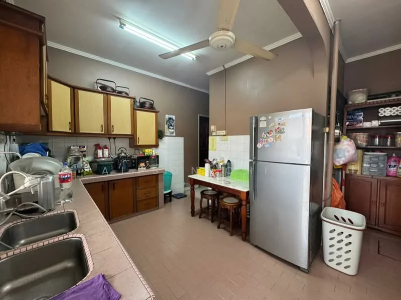 Kitchen features: brown wooden cabinetry, white countertops, double-bowl stainless-steel sink, chrome faucet, stainless-steel fridge, 4-burner gas hob, built-in oven, wooden dining stools, open shelving, laundry basket, tile flooring, ceiling fan, wall-mounted storage, various kitchen appliances; style: traditional.