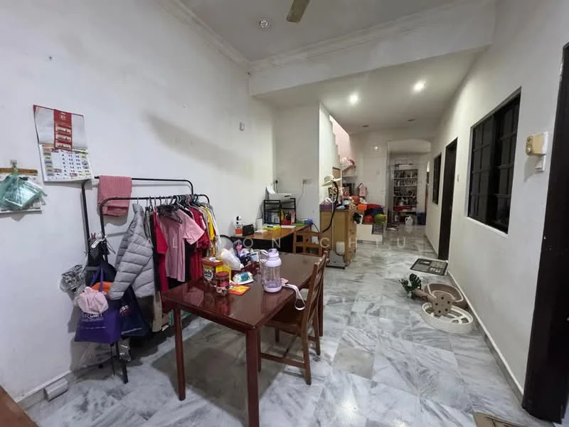 Room features: marble flooring, white painted walls, ceiling with recessed lighting, wooden dining table, 4 wooden chairs, clothing rack, various items on the floor, open layout, doorway leading to another room, windows with black frames.