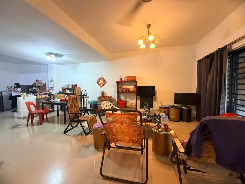 Living features: white painted walls, polished tile flooring, ceiling fan, recessed ceiling lights, two wall-mounted TVs, wooden shelving unit, various chairs, dining table with chairs, decorative items on shelves, window with black grills, curtains, open layout to kitchen area.