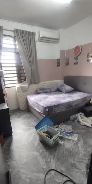 Bedroom features: queen-size bed with grey upholstered headboard, light grey bedding, marble tile flooring, 1 wall-mounted split AC, curtains in beige, decorative wall clock, multiple wall-mounted photos, bedside table, cluttered with personal items.