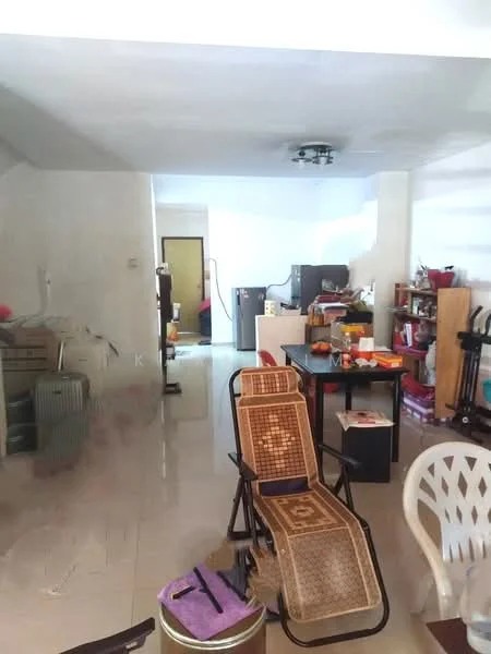 Living features: white painted walls, glossy tile flooring, ceiling fan, recessed lighting, wooden dining table, plastic chairs, storage shelves, kitchen area visible in background, luggage, decorative items on shelves.
