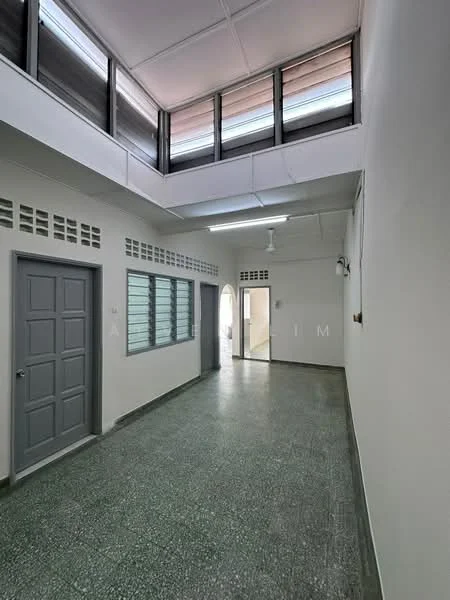 Room features: grey painted walls, green terrazzo flooring, exposed ceiling, ceiling fan, large windows with horizontal slats, door with panel design, multiple doorways, natural light from windows; style: modern.