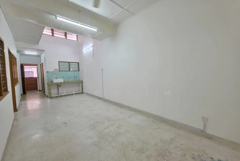 Room features: white painted walls, concrete flooring, ceiling with fluorescent lights, window with wooden grille, sink with backsplash, open layout, natural light from skylight, no visible furniture; style: minimalist.