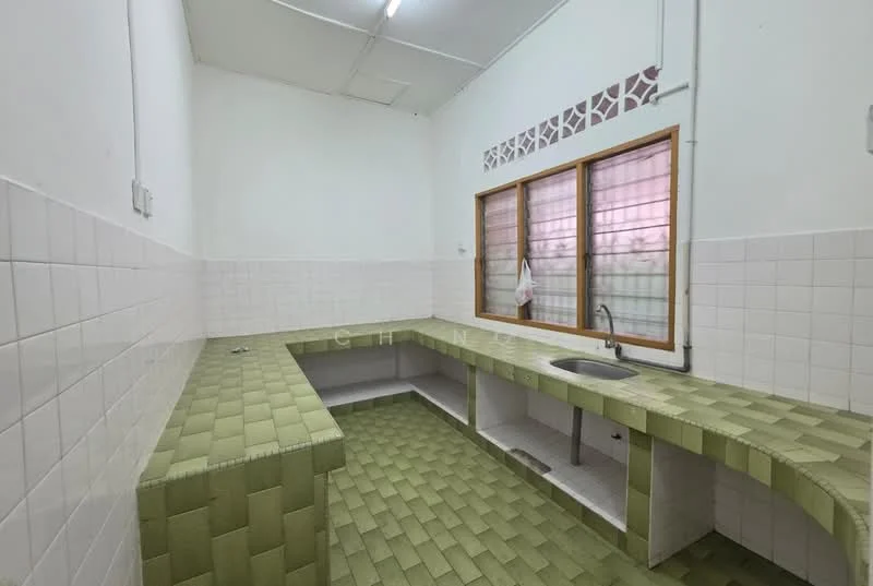 Kitchen features: green tiled countertop, white tiled walls, green tiled flooring, single-bowl stainless-steel sink, wooden window frame, window with grid pattern, open layout, no visible appliances.