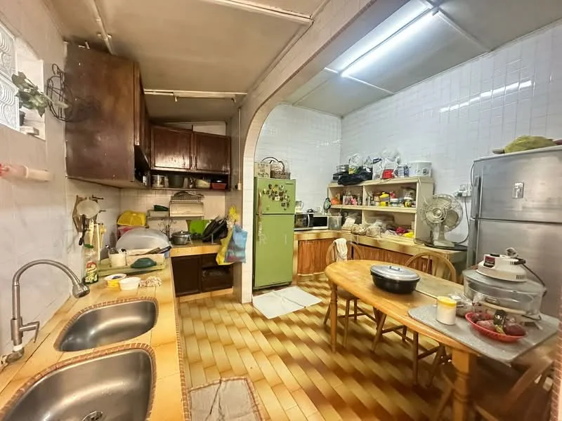 Kitchen features: double-bowl stainless-steel sink, chrome pull-down faucet, green fridge, wooden cabinetry, tile backsplash, wooden dining table, 4 dining chairs, ceiling fan, ceramic tile flooring, white tiled walls, open shelving, countertop with appliances, kitchen utensils visible; style: traditional.