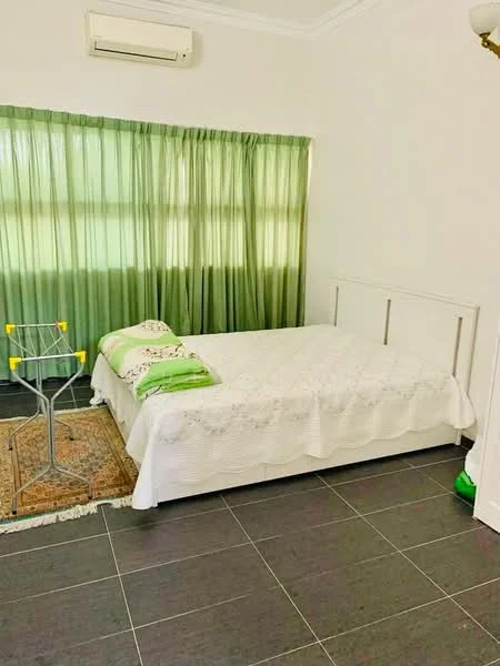 Bedroom features: queen-size bed with white bedding, green decorative pillows, green sheer curtains, white painted walls, dark tiled flooring, air conditioning unit on wall, area rug, clothes drying rack.