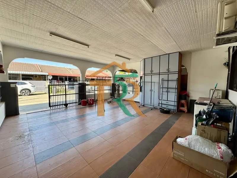 Room features: tiled flooring in beige, white painted walls, exposed ceiling with texture, metal security gate, built-in cabinets in white, open space layout, natural light from windows, storage shelving, visible outdoor area through gate; style: modern.