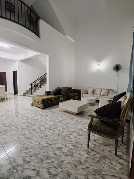 Living features: marble tile flooring, white painted walls, high ceiling, ceiling fan, 3-seater fabric sofa in beige, 2-seater fabric sofa in brown, coffee table, decorative wall sconce, staircase in background, open layout, large windows, area rug; style: modern.