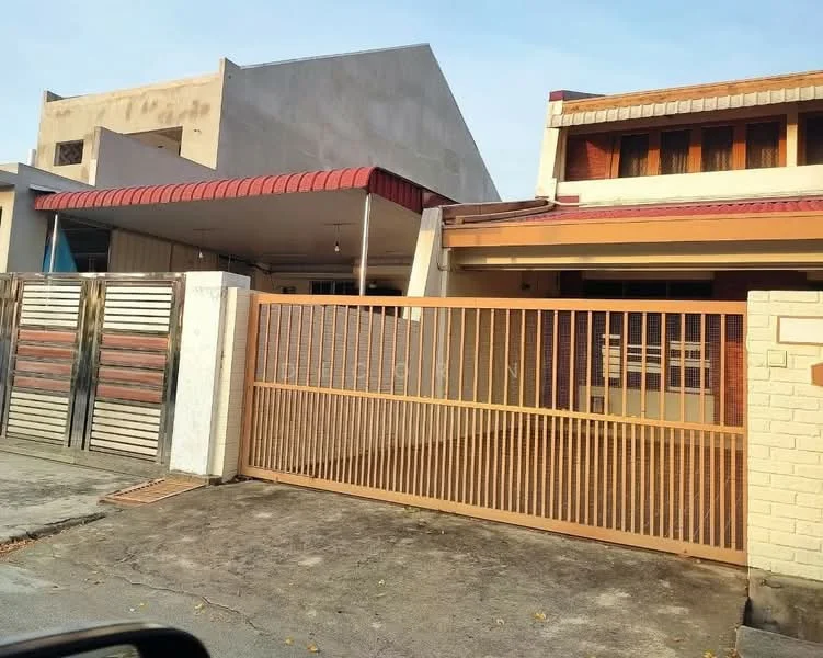 Exterior type: semi-detached house; features: metal gate, concrete driveway, red awning, single-storey, exposed brick facade, flat roof, manicured lawn, surrounded by other residential buildings; style: traditional.