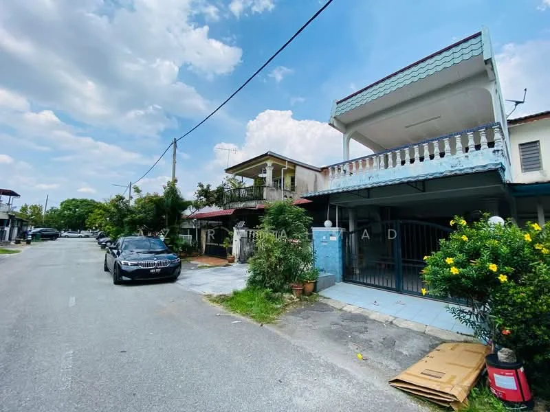 Exterior type: linked terrace house; features: two-storey house, blue painted facade, balcony with railing, manicured garden, driveway with car, paved walkway, surrounded by greenery, street view, open-air parking, gated entrance; style: modern.