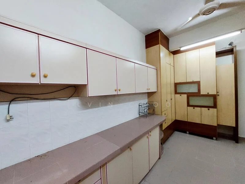 Kitchen features: laminate countertop, cream cabinetry with pink trim, built-in cabinets, wall-mounted storage, white tiled backsplash, ceiling fan, grey tiled flooring.