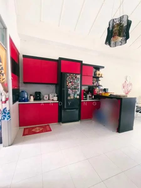 Kitchen features: red cabinetry, black countertop, black refrigerator, stainless-steel sink, chrome faucet, white tiled flooring, white walls, ceiling with exposed beams, decorative pendant light, kitchen appliances including kettle and microwave, area rug with geometric pattern; style: modern.