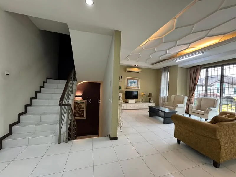 Living features: white tiled flooring, cream painted walls, tray ceiling with recessed lighting, large windows with sheer curtains, two armchairs in beige fabric, sofa in brown fabric, black coffee table, TV console with wall-mounted TV, decorative wall art, air conditioning unit; style: contemporary. Hallway features: white tiled flooring, cream painted walls, staircase with wooden handrail, framed artwork on wall.
