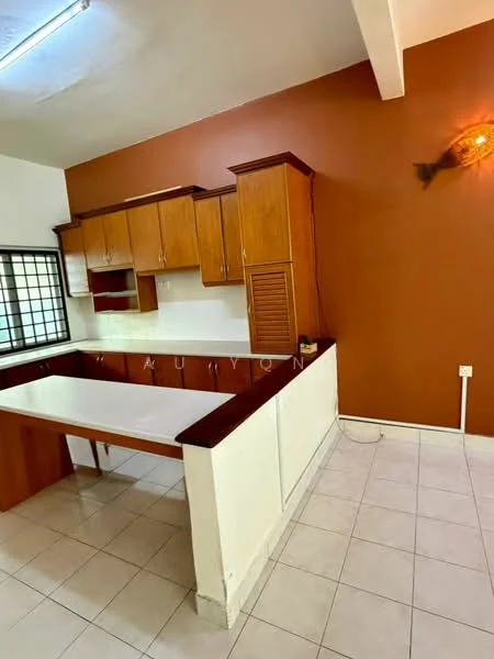 Kitchen features: wood cabinetry, white countertop, brown accent wall, tile flooring, window with metal grille, built-in shelving, kitchen island, under-cabinet lighting; style: traditional.