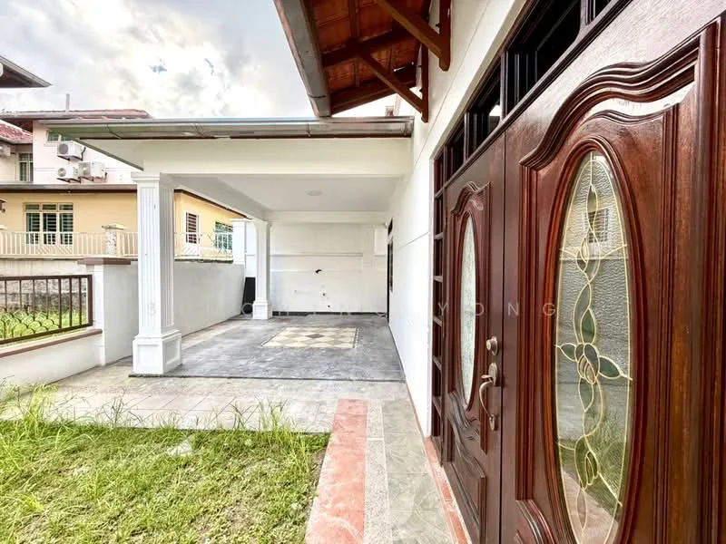 Exterior type: detached bungalow; features: double-door main entrance with decorative glass panels, covered porch area, paved flooring, manicured lawn, exposed wooden beams on roof, white painted walls, surrounded by greenery; style: modern.