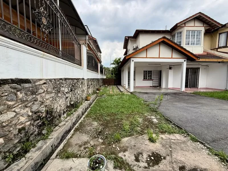Exterior type: semi-detached house; features: stone wall, manicured lawn, paved walkway, driveway, covered car porch, two-storey structure, gabled roof, balcony on upper floor, fenced yard, garden area; style: traditional.