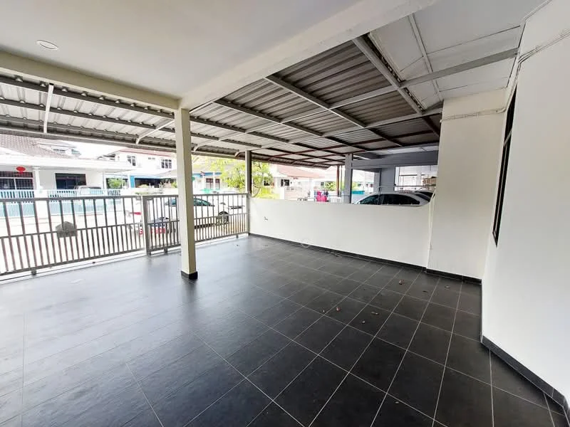 Exterior type: car porch; features: covered car porch, black tile flooring, metal roof, open space, fenced perimeter, two visible cars, concrete walls, front gate, surrounded by residential buildings; style: modern.