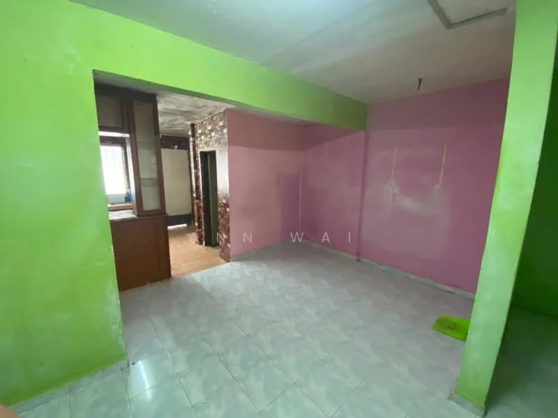 Room features: green painted walls, pink painted walls, ceramic tile flooring, exposed brick wall, window with natural light, open layout, no visible furniture, ceiling with no visible fixtures.