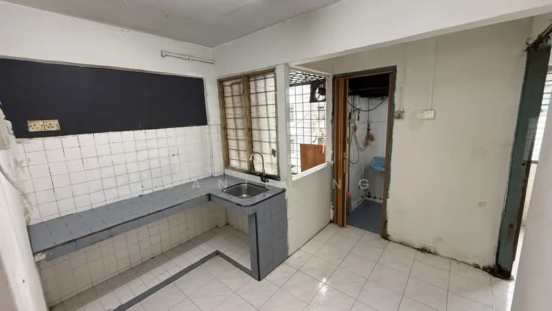 Kitchen features: single-bowl stainless-steel sink, chrome faucet, grey tiled countertop, white tiled backsplash, white tiled walls, white ceramic floor tiles, window with metal grille, open layout, built-in cabinetry, exposed plumbing. Room features: doorway leading to another room, window with metal grille, laundry area visible, light fixture on ceiling.