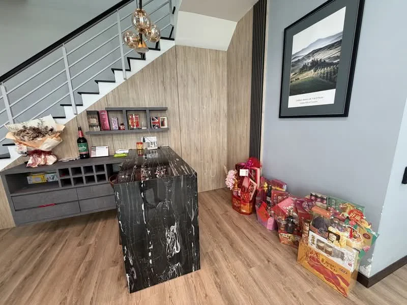 Room features: black marble countertop, wooden cabinetry, grey cabinetry with open shelving, wood panelled walls, laminate flooring, pendant lighting, decorative wall art, bottles and snacks on display, gift baskets, flowers in a vase; style: modern.