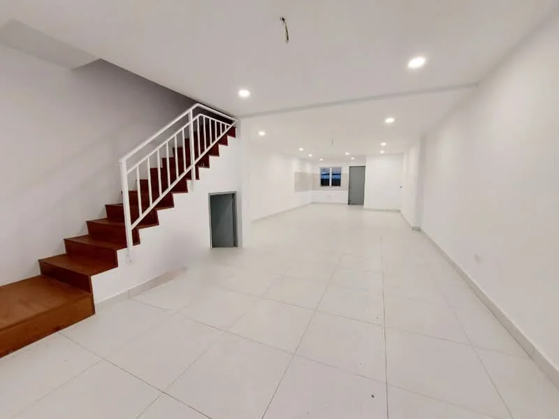 Room features: white painted walls, white ceiling, recessed downlights, staircase with wooden steps and white railing, large floor tiles in white, open layout, windows allowing natural light, no visible furniture or decor; style: modern.