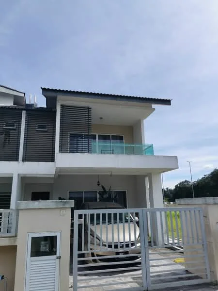 Exterior type: linked terrace house; features: two-storey building, glass balcony railing, grey painted facade, horizontal wooden slats, flat roof, driveway with interlocking pavers, car parked in driveway, manicured lawn, surrounded by greenery; style: modern.