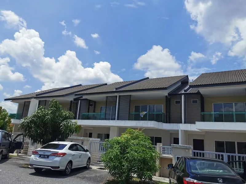 Exterior type: linked terrace house; features: two-storey building, brown timber cladding, white painted facade, flat roof, balconies with glass railings, manicured landscaping, parking spaces in front, surrounded by greenery, cloudy blue sky; style: modern.