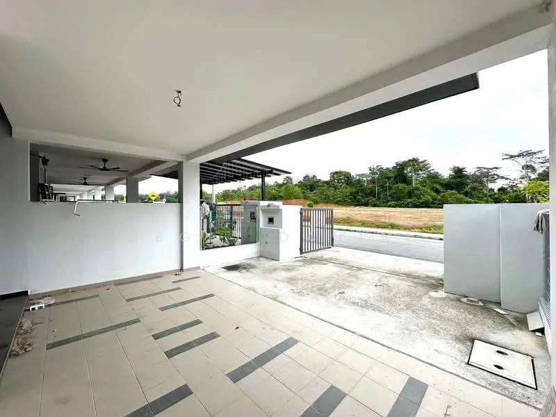 Exterior type: linked terrace house; features: covered porch area, paved flooring with tile pattern, open space in front, fenced perimeter, gate access, landscaped area with greenery, ceiling fan, exposed concrete wall, light fixture, driveway, view of open land; style: modern.