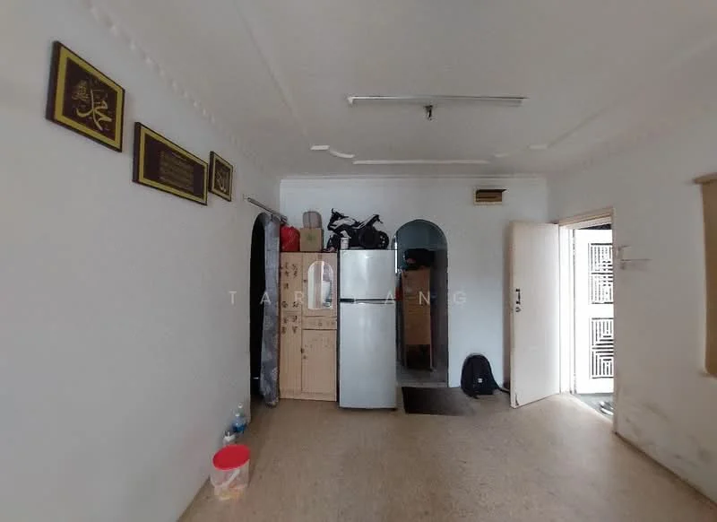 Room features: white painted walls, laminate flooring, refrigerator, wooden cabinetry, arched doorway, door leading outside, decorative wall plaques, bicycle, plastic container, black backpack.