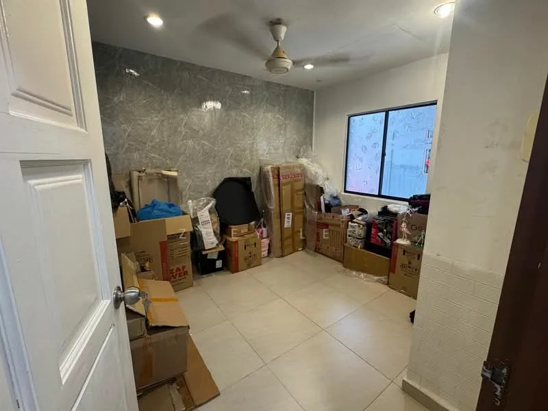 Room features: grey marble accent wall, white painted walls, light-colored tile flooring, ceiling fan, large window, boxes and packing materials, cluttered storage, door leading to hallway.