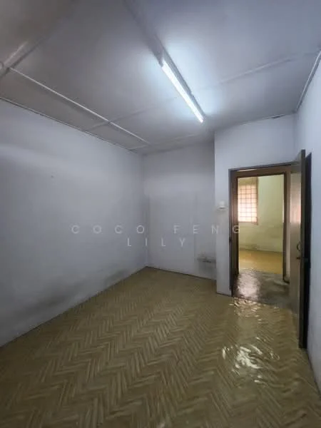 Room features: white painted walls, vinyl flooring, fluorescent ceiling lights, single door, window with natural light, herringbone pattern flooring.