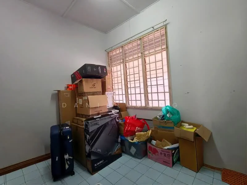 Room features: white painted walls, vinyl tile flooring, window with grid pattern, stacked boxes, luggage, various bags, cardboard boxes, cluttered space.