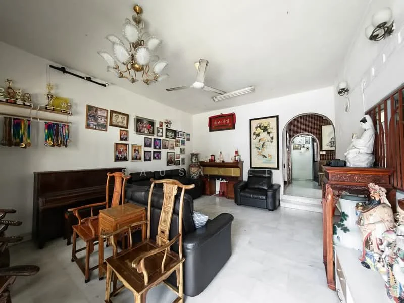 Living features: white painted walls, marble flooring, 5-blade ceiling fan with light, chandelier, wall-mounted artwork, wooden furniture, black leather sofa, wooden chairs, decorative figurines, trophy display, arched doorway, decorative wall paneling; style: traditional.
