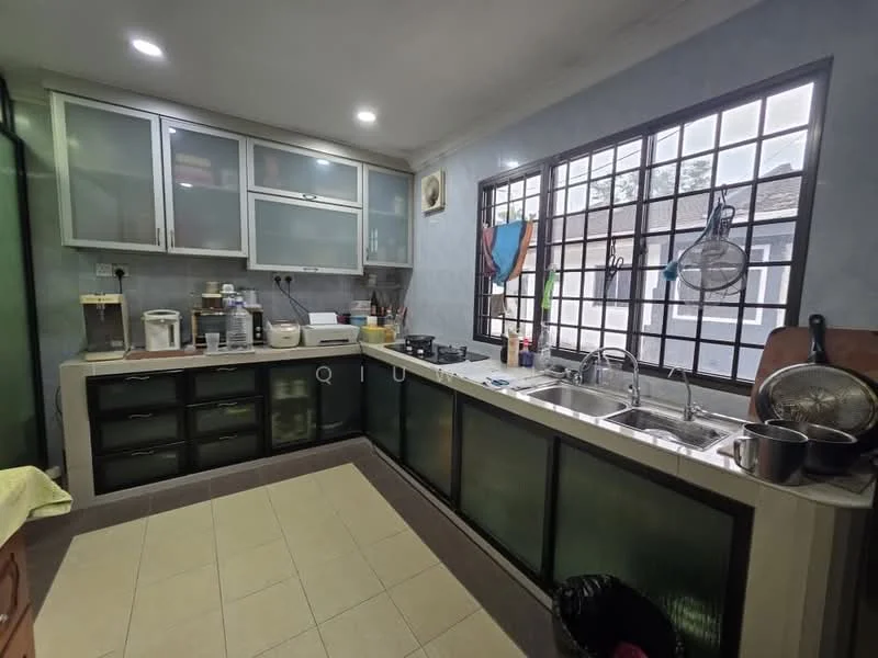Kitchen features: green glass cabinet doors, white countertop, double-bowl stainless-steel sink, chrome pull-down faucet, built-in gas stove, microwave, kitchen utensils on countertop, tile flooring, window with metal grilles, wall-mounted storage rack, black trash bin; style: modern.