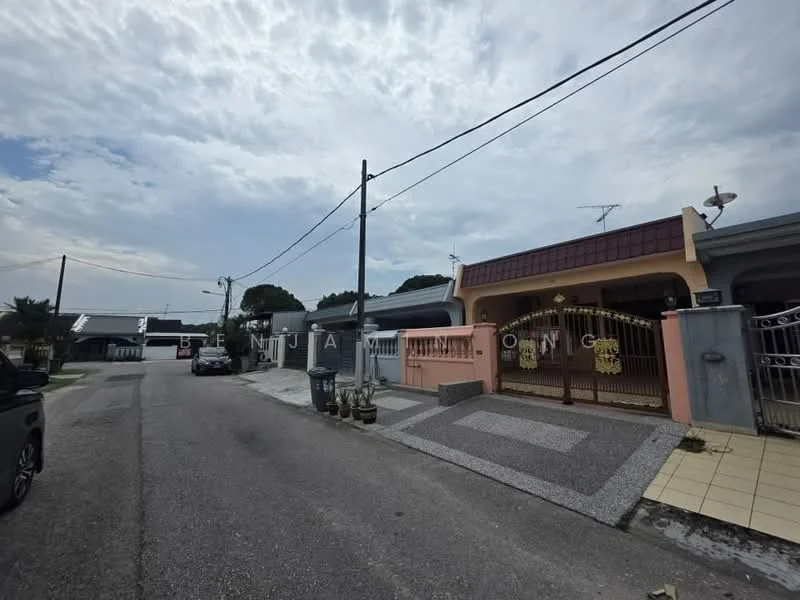 Exterior type: linked terrace house; features: pink painted facade, grey tiled roof, paved walkway, manicured lawn, front gate with decorative elements, driveway with interlocking pavers, street view with power lines, surrounded by residential area; style: modern.