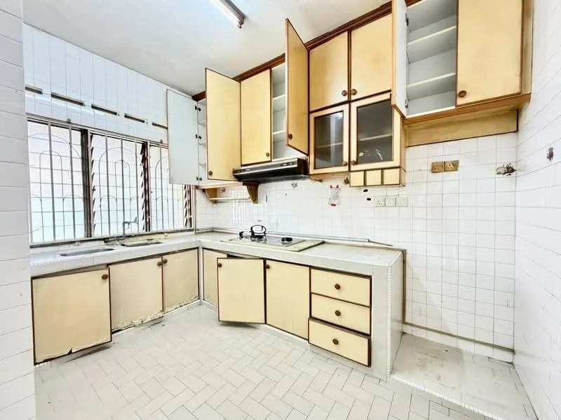 Kitchen features: white tiled walls, cream cabinetry with glass-front upper cabinets, laminate countertop, single-bowl stainless-steel sink, 4-burner gas hob, exhaust hood, window with metal grille, tile flooring, built-in cabinets, under-cabinet lighting.