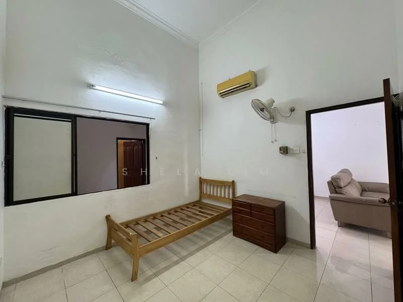 Bedroom features: white painted walls, tile flooring, single bed frame, wooden dresser, window with black frame, wall-mounted air conditioning unit, ceiling fan, light fixture, door leading to another room.