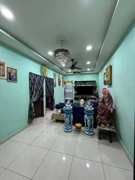Living features: light green painted walls, white ceiling with recessed lighting, polished ceramic tile flooring, chandelier, 5-blade ceiling fan, sofa in dark blue, decorative wall art, two decorative blue vases, statue of a seated figure, curtains in grey, wooden storage cabinet, decorative items on shelves; style: modern.