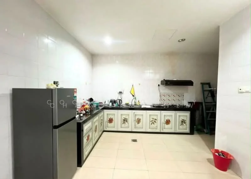 Kitchen features: white tiled walls, cream tiled flooring, L-shaped kitchen layout, black countertop, stainless-steel fridge, built-in gas stove, exhaust hood, kitchen cabinets with floral design, sink, kitchen utensils visible, open shelving, ladder for storage, red plastic bin; style: modern.