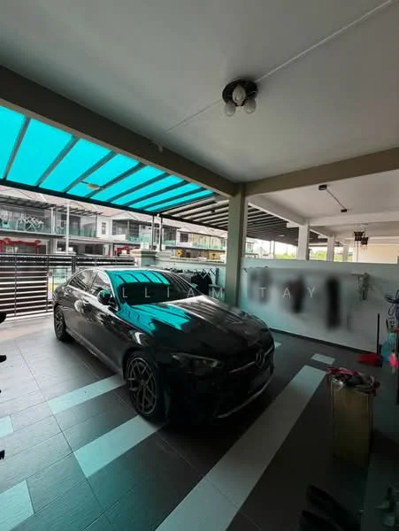 Exterior type: car porch; features: covered car porch with transparent roof panels, grey tiled flooring, black luxury car parked, metal railing, outdoor lighting fixture, side wall with glass panels, visible residential units in background; style: modern.