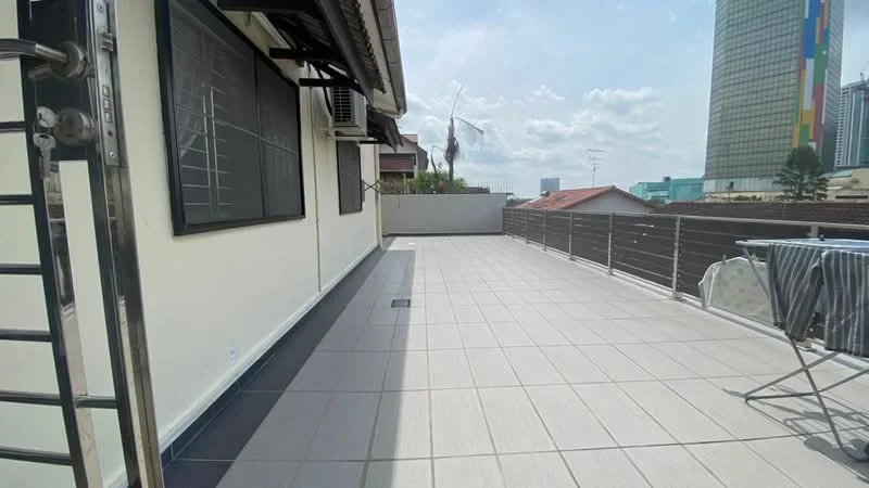 Exterior features: large terrace, grey tiled flooring, metal railing, partial city skyline view, air conditioning unit visible, sunny outdoor space; style: modern.