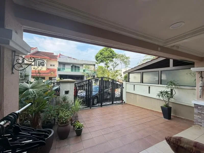 Exterior type: linked terrace house; features: gated entrance, tiled flooring, manicured garden, potted plants, covered porch area, decorative wall, metal gate, surrounding greenery; style: modern.