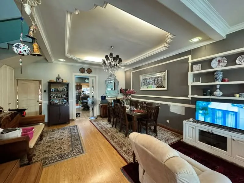 Living features: wooden flooring, white painted walls with crown moulding, tray ceiling, chandelier, wall-mounted TV, TV console, sofa in cream fabric, coffee table, area rug with geometric pattern, decorative wall shelves, framed artwork, dining table with chairs, vase with flowers; style: traditional. Dining features: dining table with wooden finish, upholstered dining chairs, decorative wall shelves, vase with flowers; style: traditional.