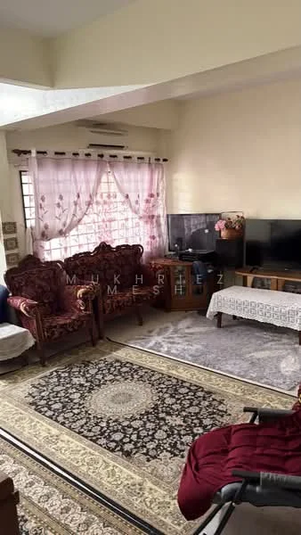 Living features: cream painted walls, wall-to-wall carpet, 3-seater fabric sofa in maroon, 2 armchairs in maroon upholstery, coffee table, TV console, wall-mounted TV, decorative area rug with geometric pattern, curtains with floral pattern, window with grid design, decorative wall art, ceiling fan; style: traditional.