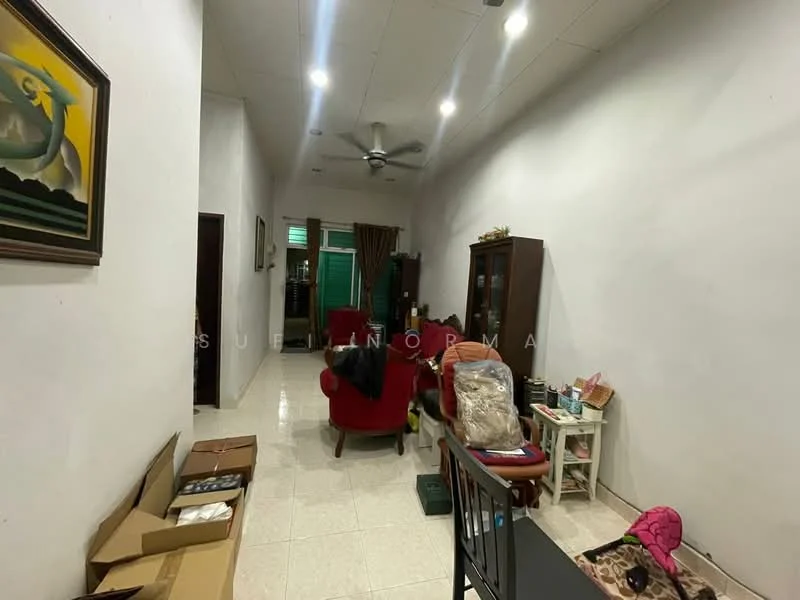 Living features: white painted walls, tile flooring, 5-blade ceiling fan with light, two red armchairs, wooden display cabinet, coffee table, decorative painting on wall, boxes on the floor, green curtains, wall-mounted light fixture.