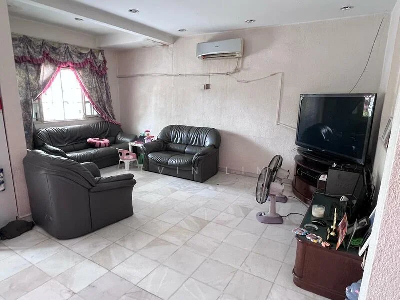 Living features: black leather 3-seater sofa, black leather 2-seater sofa, pink children's chair, flat-screen TV on TV console, wall-mounted air conditioning unit, ceiling lights, tile flooring, curtains with floral pattern, decorative wall, small table, standing fan.